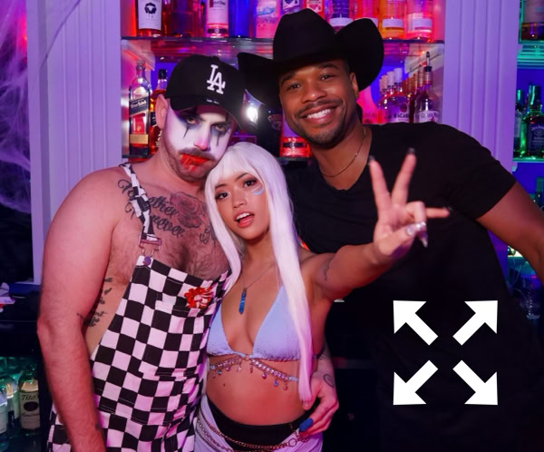 Women enjoying a lively night out at a club, filled with laughter and style.